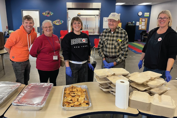 Volunteers helping with meal