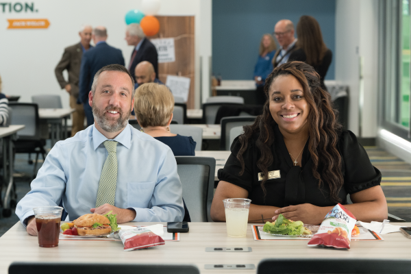 Photo of Chanel Jones and Ronnie Hewitt eating lunch together.