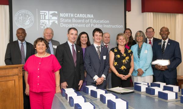  Ian House stands with other board members and former State Superintendent Catherine Truitt during his August 2024 swearing-in ceremony.
