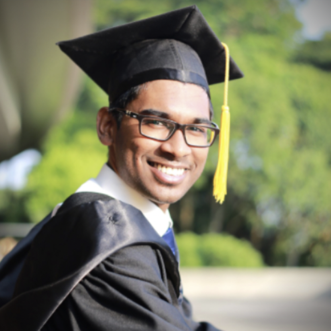 Smiling student wearing graduation attire