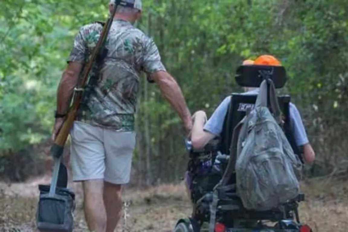 Father escorts son in wheelchair into the woods for a hunt