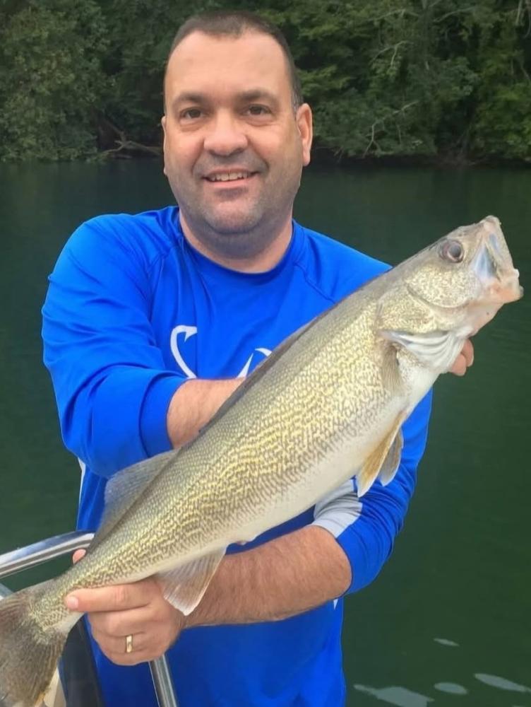 Biologist holding Walleye FIsh