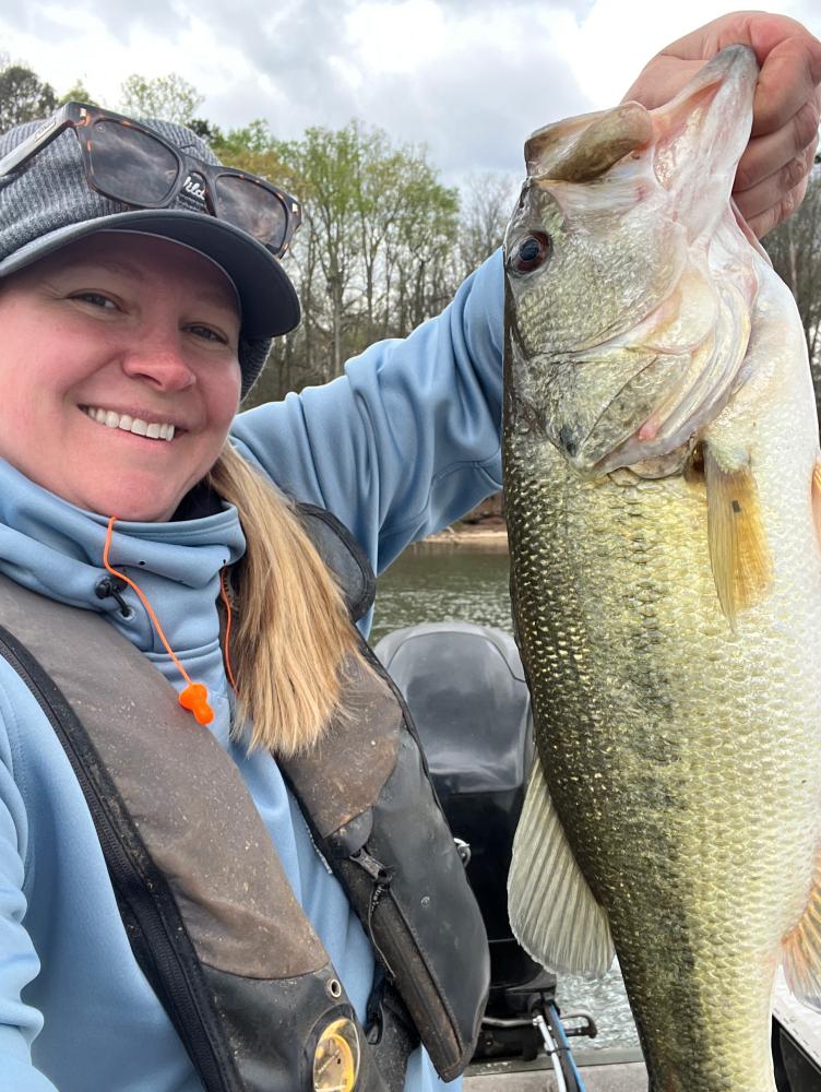 Biologist holding largemouth bass