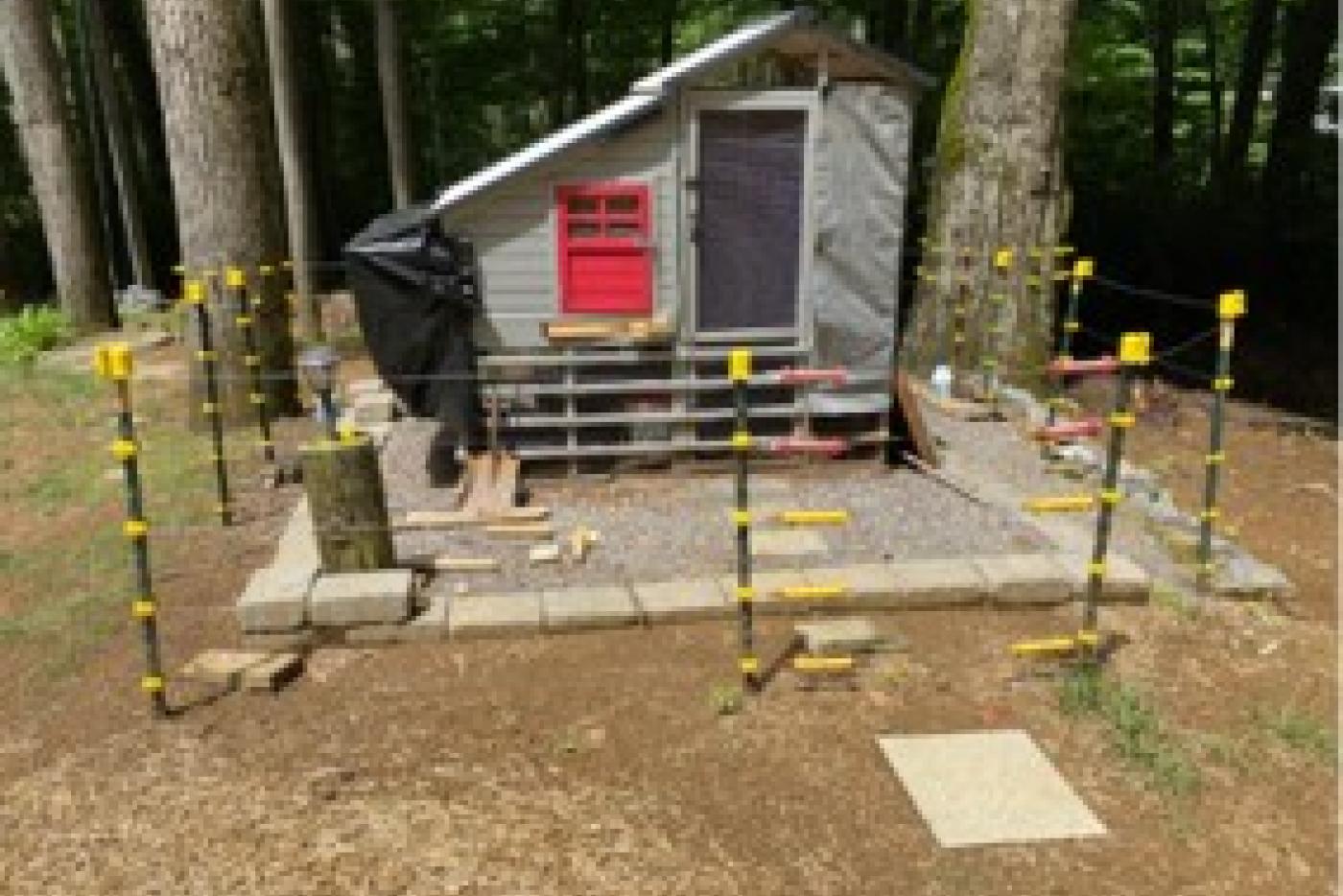 an electric fence around a chicken coop to protect from bears
