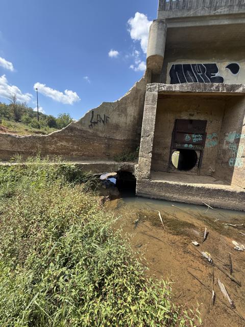 Storm damage created a hole in Lake Craig Dam, allowing water to flow through