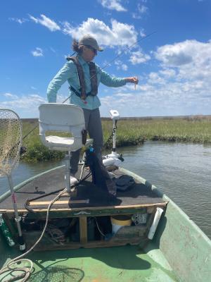 Kelly Davis observes Swan Quarter from a small boat