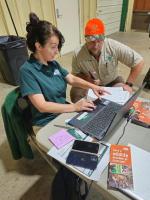 Christina Stylianos consults with a trapper at her computer