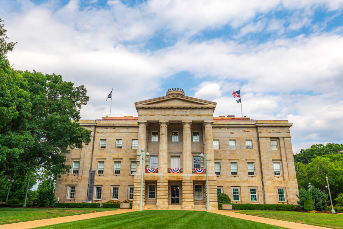 NC Capitol Building with flags