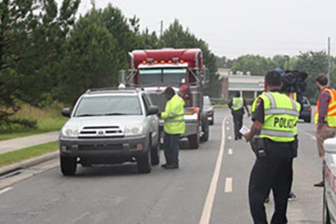 Emergency responders training with stopped vehicle