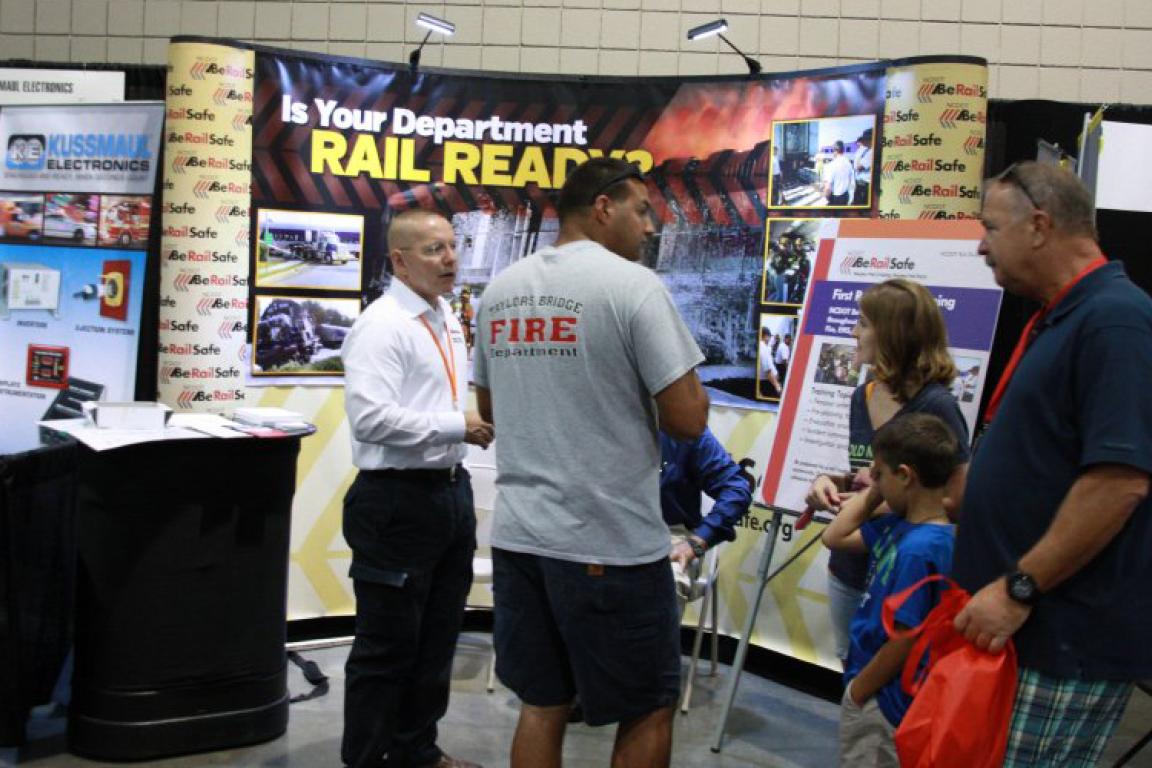 People and families visiting a Rail safety exhibit