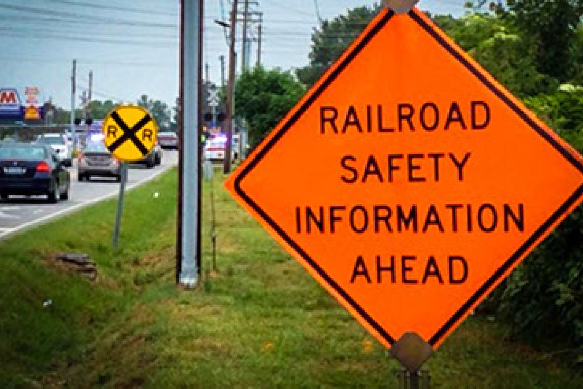 Railroad Safety Information Ahead orange road sign