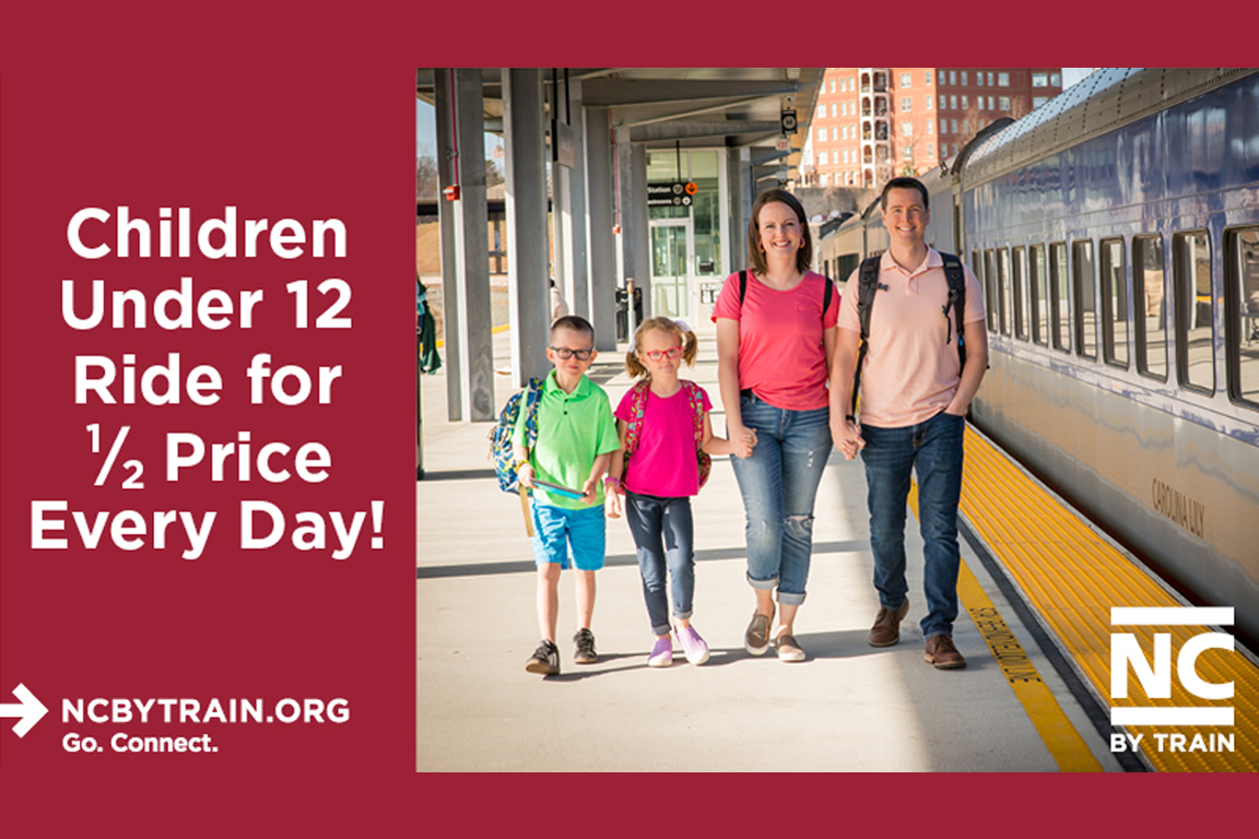 Children under 12 ride for half price every day. Family with kids standing by the train.