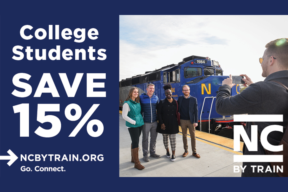 College students save 15%. Group of students taking a photo in front of a train.