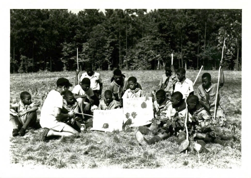 Boyscouts learning about native plants and animals at Crabtree Creek or Reedy Creek State Park, ca. 1940s to 1950s. North Carolina State Parks Collection, NC Digital Collections.