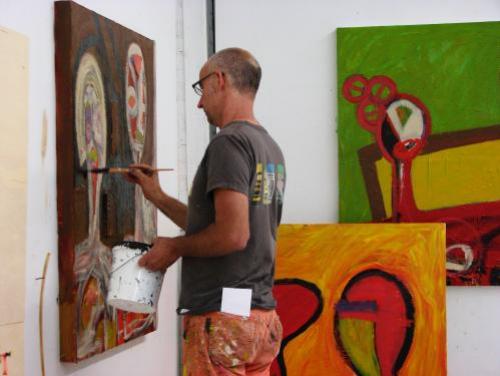 An Artist Paints in His Studio