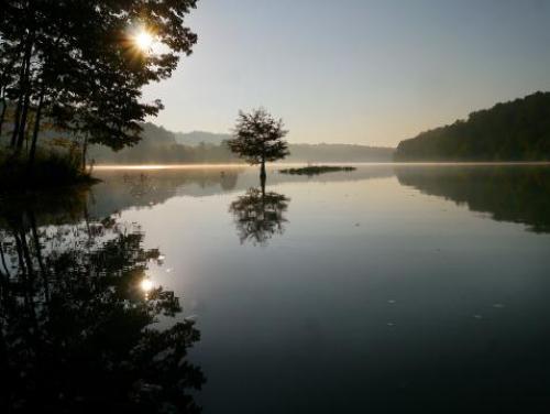The sun rises over Jordan Lake