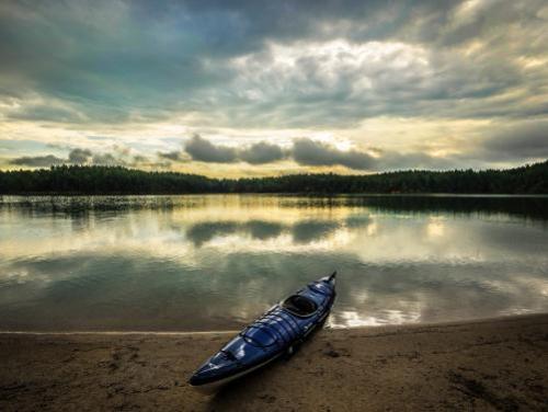 A kayak on the shore of Lake James