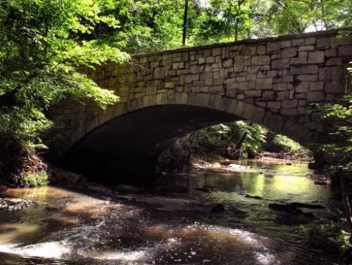 A bridge spanning one of the many creeks at William B. Umstead State Park