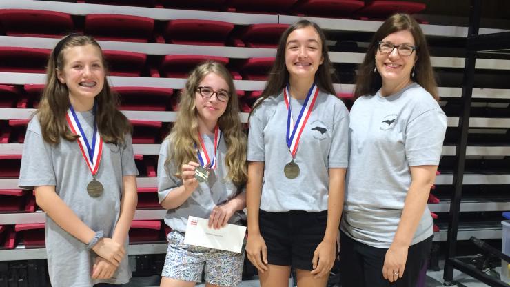 Grace Amantea, Catherine Boyette, Laura Shelton, and teacher Anne Boyette won a prize for group performance at the National History Day Competition