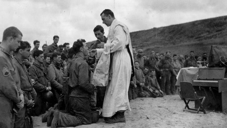 Father John McGovern gives mass in France during World War II. Image from the U.S. Army. Father John McGovern gives mass in France during World War II. Image from the U.S. Army.