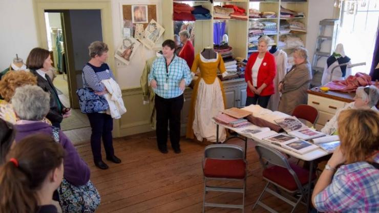 Visitors tour the costume shop at Tryon Palace