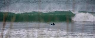 Photography by Secret Spot's Tristin Heath Surfer paddling out to the waves