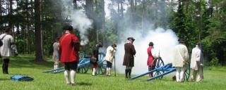 Re-enactors fire a cannon at Alamance Battleground Re-enactors fire a cannon at Alamance Battleground