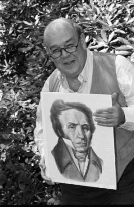 Famed journalist Charles Kuralt holds a portrait of Michaux at Grandfather Mountain in 1994. Image from the UNC-Chapel Hill Library