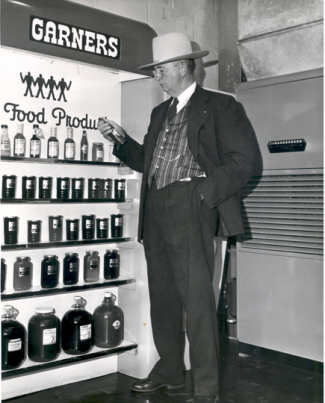 Sam Garner, father of Texas Pete founder Thad Garner, picks up a bottle of sauce. Image courtesy of TW Garner Food Company.