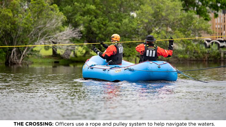 THE CROSSING: Officers use a rope and pulley system to help navigate the waters. Officers use a rope and pulley system to help navigate the waters.