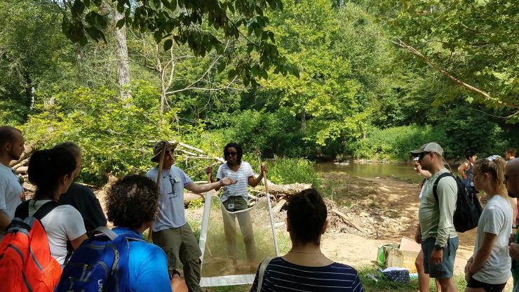 Teachers learn about stream health at Eno River State Park.