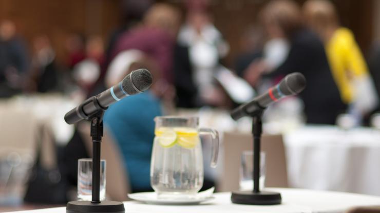 Marine FIsheries Commisison Meetings Microphones on a table for a public meeting.
