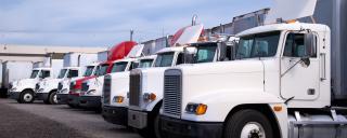 row of parked tractor trucks