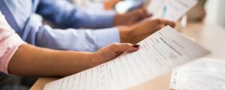 people holding documents