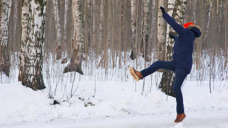 person slipping on snowy path