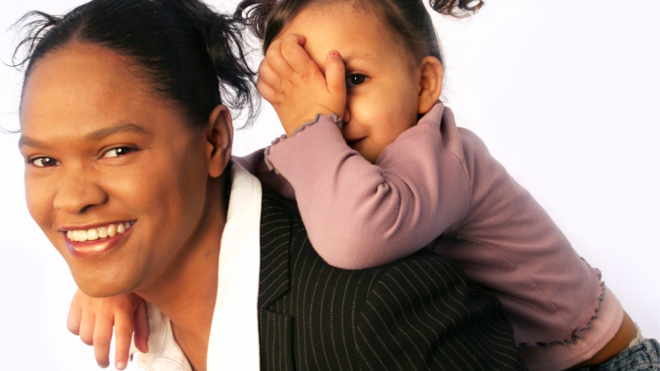 woman carrying child on her back