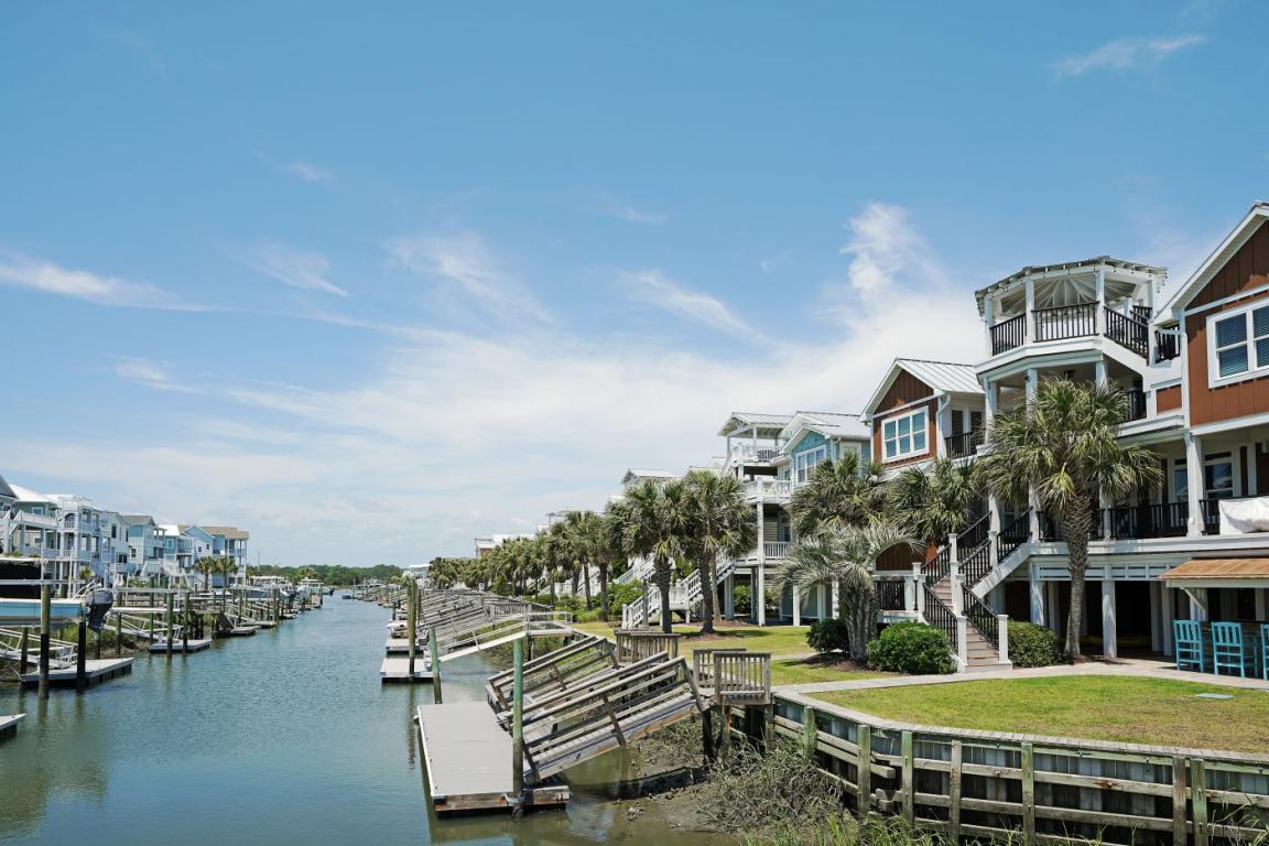 Homes along a waterway lined by docks 