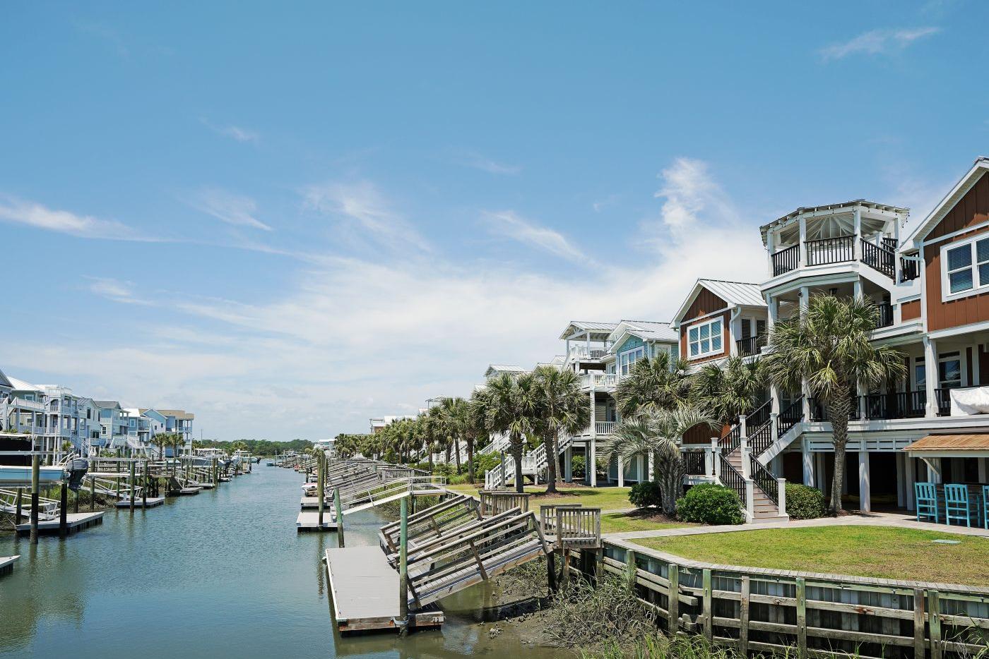 Homes along a waterway lined by docks 