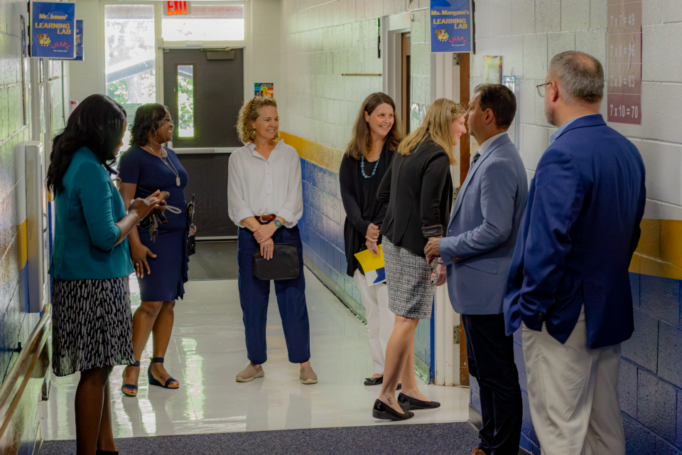 Group standing in school hallway 