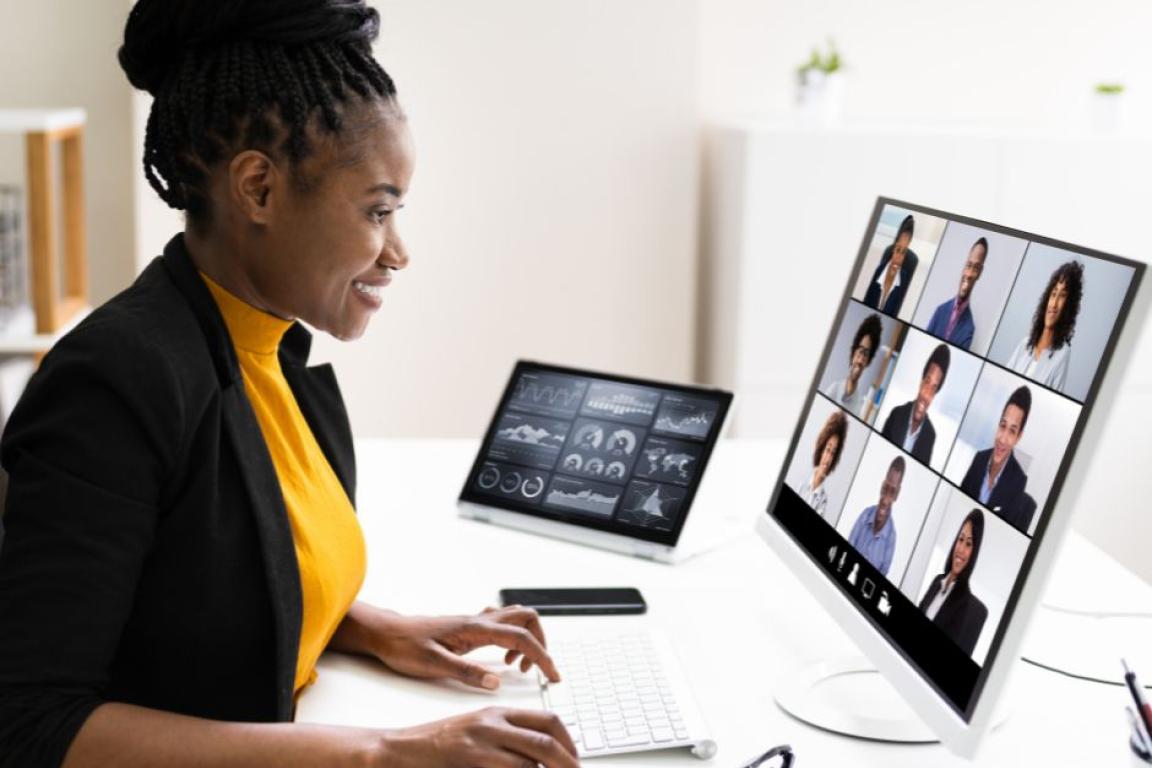 Woman participating in virtual meeting.