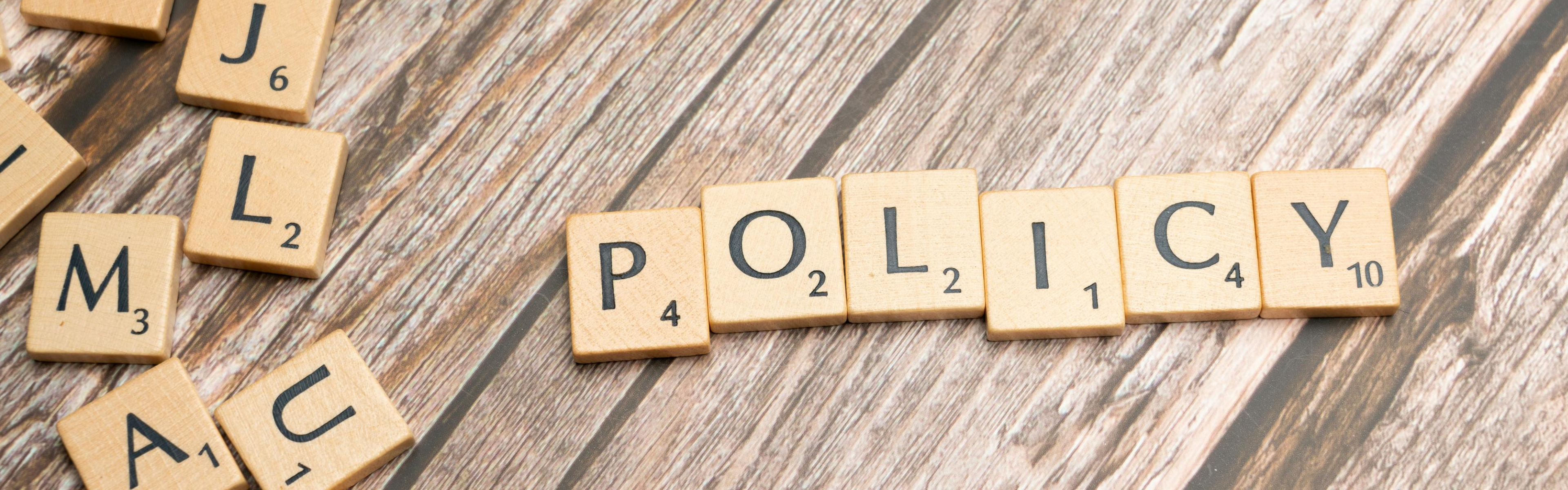 policy written in scrabble letters