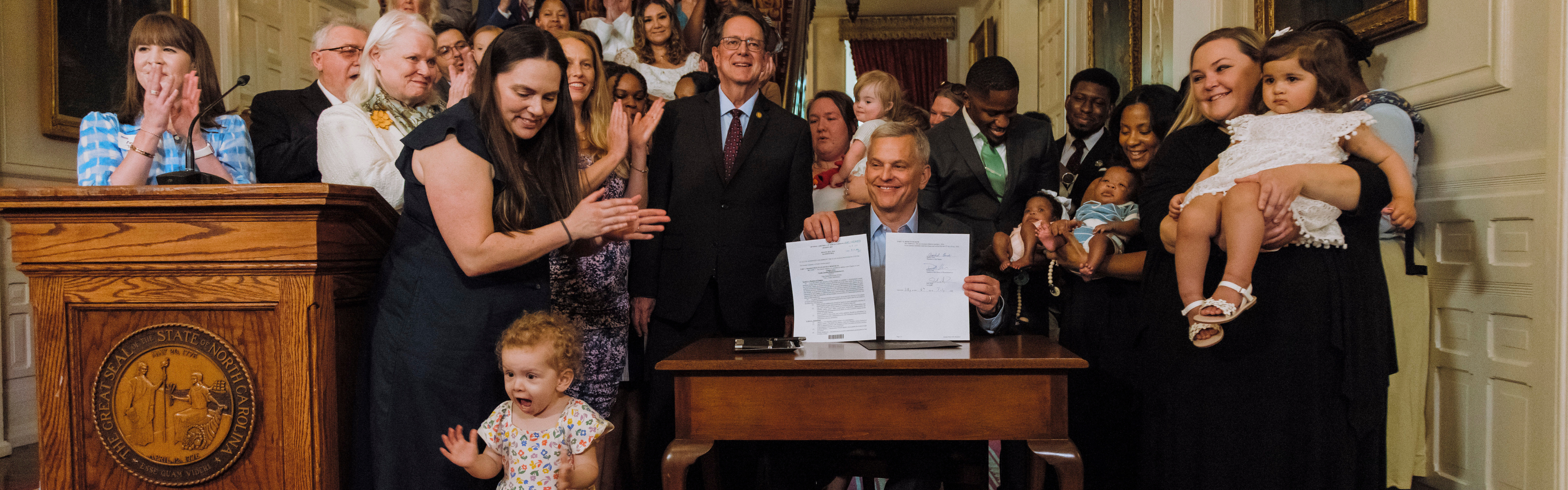 Governor Stein signing SB 1041 Into Law.
