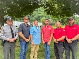 A group of six men standing in a line
