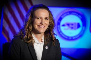 brunette woman wearing a black blazer