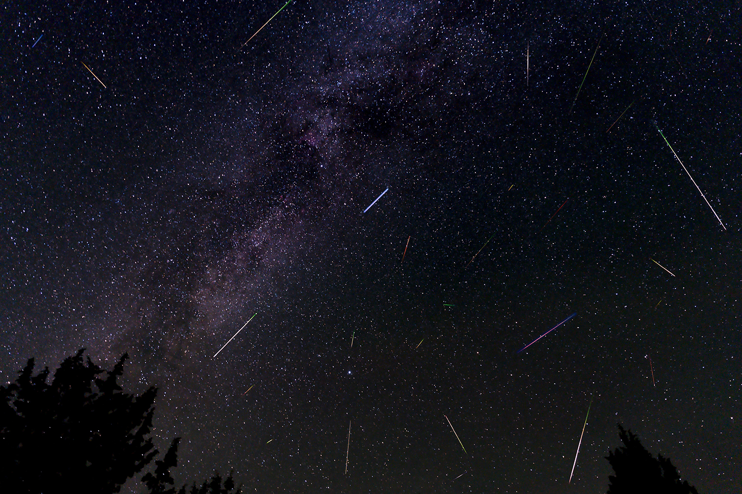 Night sky with meteorites during the Geminids meteor shower