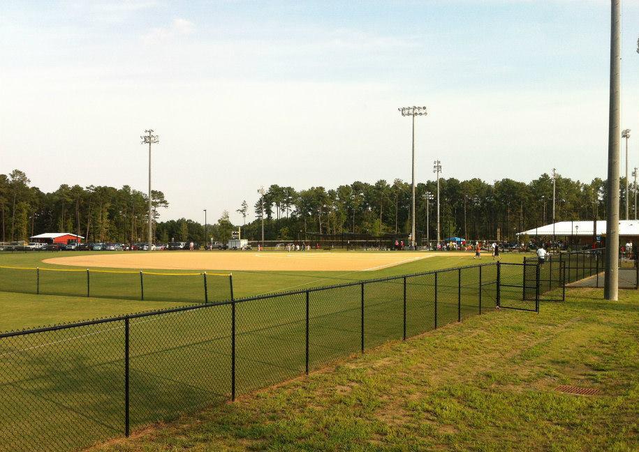 Photo of Butner Athletic Park showing a fenced baseball field with players