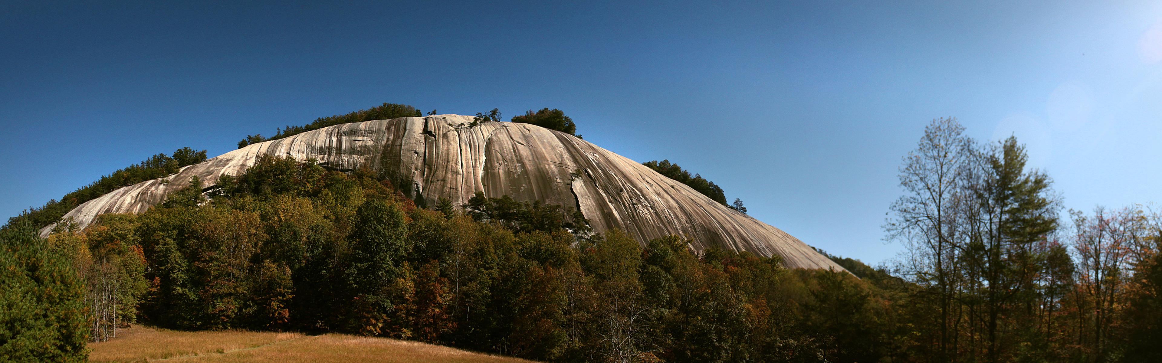 Stone Mountain rock face on a blue sky day