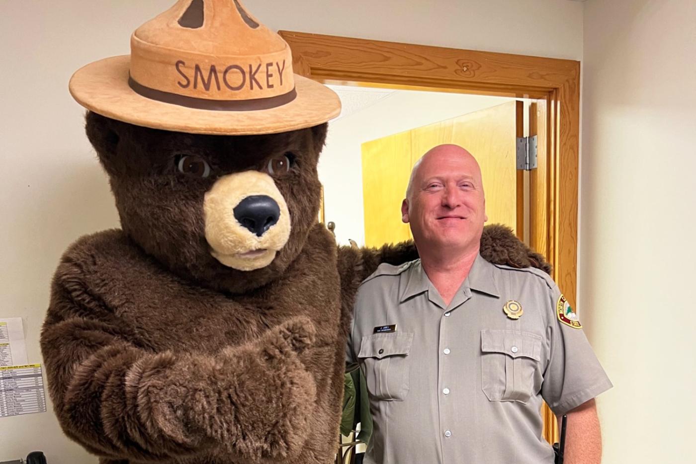 Superintendent Jeff Jones with Smokey Bear at the park office at Stone Mountain State Park