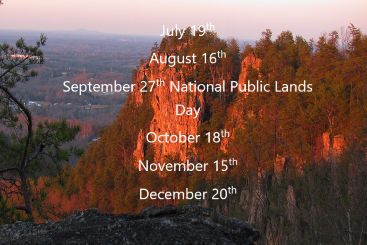 Sunset on Crowders Mountain with work dates listed