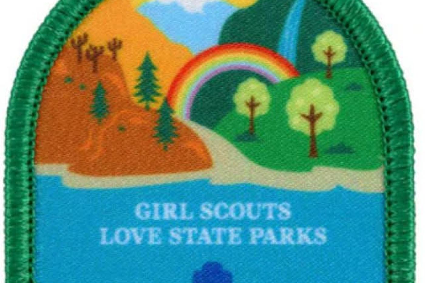 Girl Scouts Love State Parks patch with trees, water, a mountain, and a rainbow